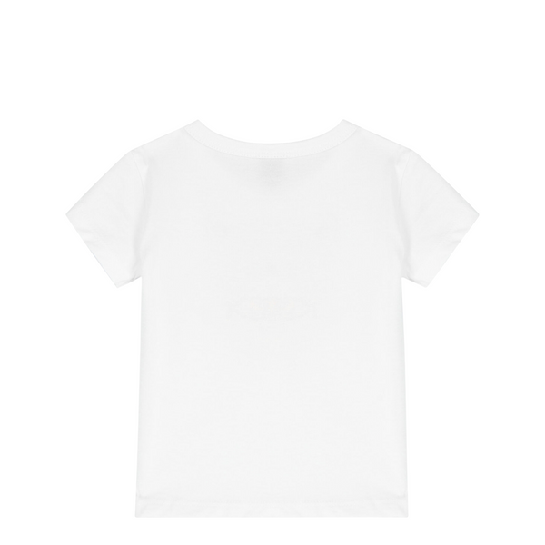 Plain white t-shirt on a light beige background