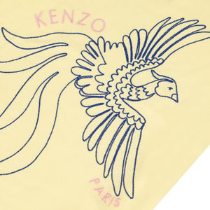 Kenzo logo with a stylized rooster on a beige background