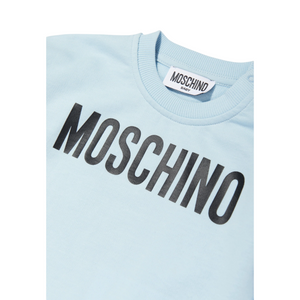 Light blue sweatshirt with 'Moschino' logo on a white background