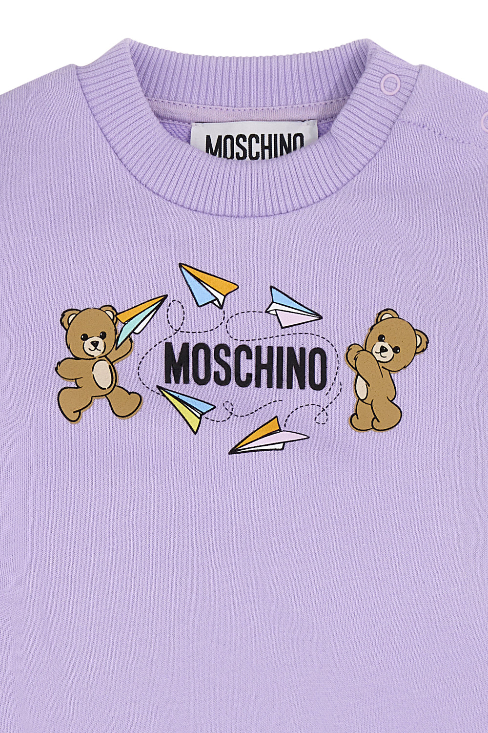 Purple children's sweatshirt and pants set with Moschino logo on a white background